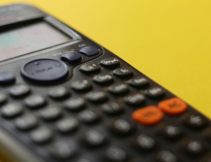 black remote control on yellow surface